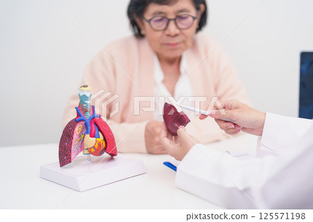 Doctor with Respiratory system. Elderly Patient consultation medical health for Lung Cancer, Asthma, Chronic Obstructive Pulmonary, Bronchitis, Emphysema, Cystic Fibrosis, Bronchiectasis, Pneumonia 125571198