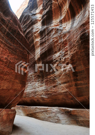 The ruins ancient path between cliffs in Petra, Jordan. 125571453