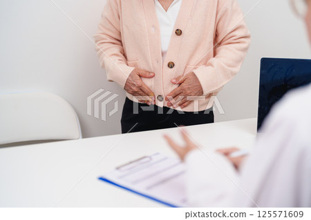Elderly Woman patient having pain and consulting doctor for Ovarian and Cervical cancer, Cervix disorder, Endometriosis, Hysterectomy, Uterine fibroids, Reproductive system and Pregnancy concept 125571609