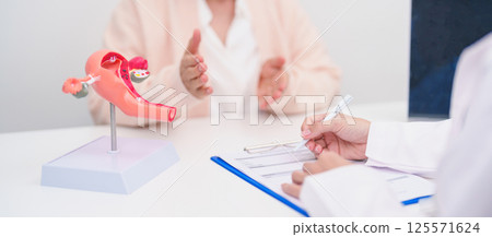 Elderly Woman patient consulting doctor with anatomy Uterus and Ovaries. Ovarian and Cervical cancer, Cervix disorder, Endometriosis, Hysterectomy, Uterine fibroids, Reproductive system and Pregnancy 125571624