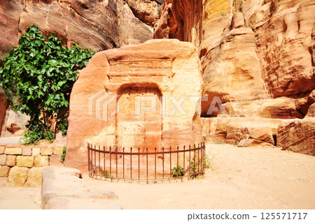 Ancient carvings on rocks in Petra, Jordan. 125571717