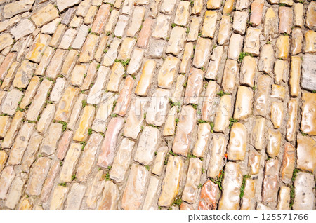 Photo of the smooth ancient stone road 125571766