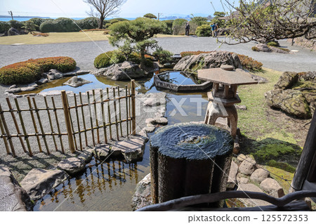 March 23 2025 Serene Japanese Garden with Tranquil Pond and Traditional March 23 2025 Serene Japanese Garden with Tranquil Pond and Traditional 125572353