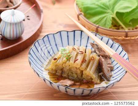 Spring wild vegetable dish: Boiled butterbur and raw dried fish Spring wild vegetable dish: Boiled butterbur and raw dried fish 125573562