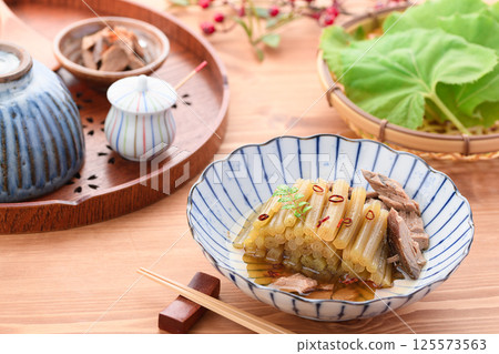 Spring wild vegetable dish: Boiled butterbur and raw dried fish Spring wild vegetable dish: Boiled butterbur and raw dried fish 125573563