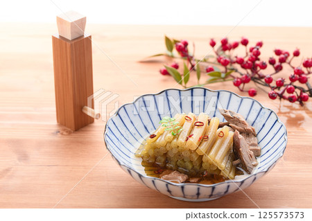 Spring wild vegetable dish: Boiled butterbur and raw dried fish Spring wild vegetable dish: Boiled butterbur and raw dried fish 125573573