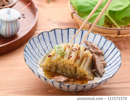Spring wild vegetable dish: Boiled butterbur and raw dried fish Spring wild vegetable dish: Boiled butterbur and raw dried fish 125573578