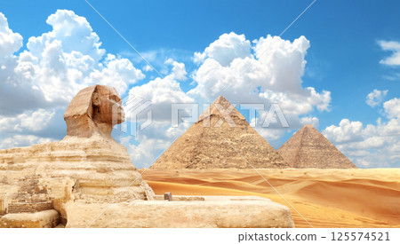 Famous Great Sphinx and pyramids of Chephren and Cheops, Cairo, Egypt. Great Pyramids and statue of Sphinx, Giza Necropolis. Topic of vacation, travel, trip abroad on vacation, cruises and tours 125574521
