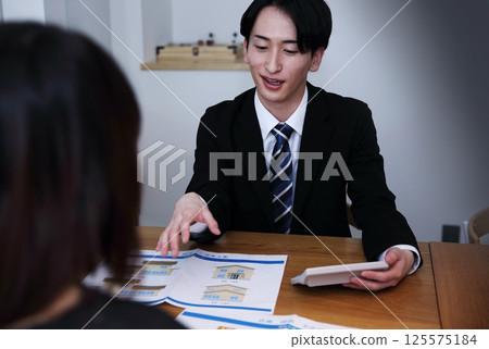 The image of unscrupulous salespeople forcing people into signing contracts 125575184