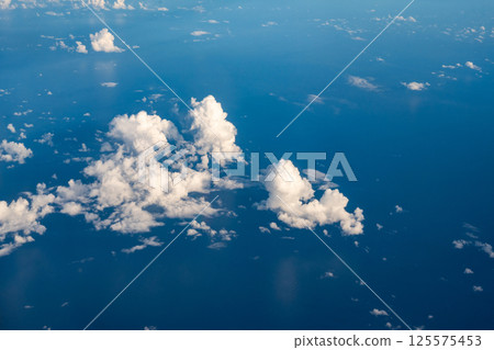 Aerial cloudscaspe picturesque clouds and sky from top view over the horizon 125575453