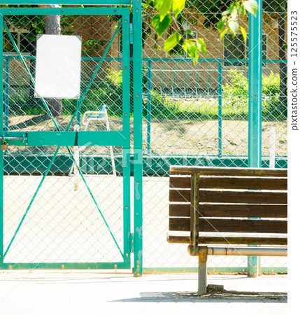 View of the tennis court on a holiday from the entrance View of the tennis court on a holiday from the entrance 125575523