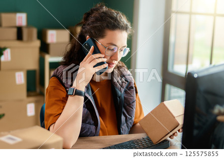 Woman working in a warehouse Woman working in a warehouse 125575855