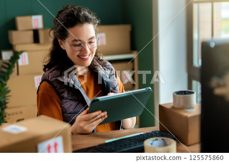 Woman working in a warehouse 125575860