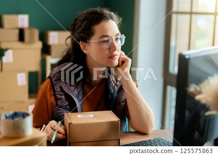 Woman working in a warehouse 125575863