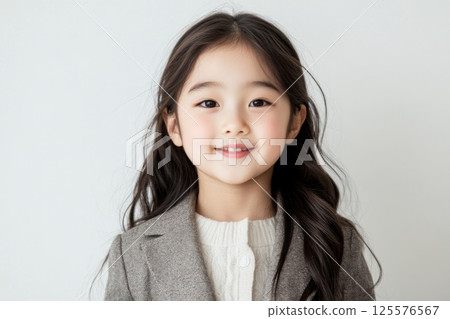 Portrait of a smiling woman looking at camera on white background Portrait of a smiling woman looking at camera on white background 125576567