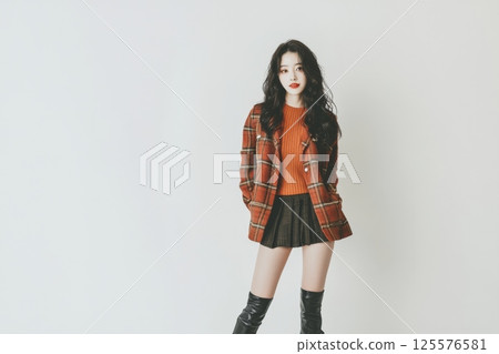 Portrait of a smiling woman looking at camera on white background 125576581