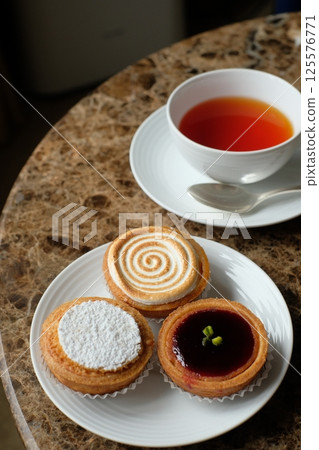 Baked goods: Citron tart, Amandine, Mille d'Amien Baked goods: Citron tart, Amandine, Mille d'Amien 125576771