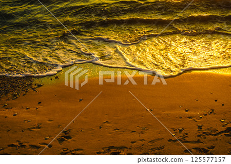 Beatiful sunset sea and beach Beatiful sunset sea and beach 125577157