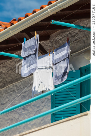 Clothes drying on a string outdoor Clothes drying on a string outdoor 125577168