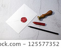 white envelop sealed with red wax 125577352
