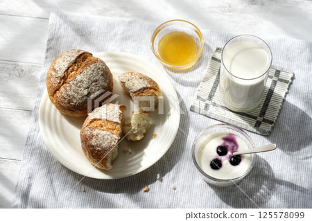 Bread, milk and yogurt breakfast 125578099