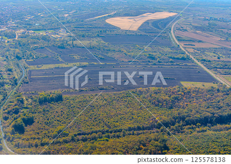 Aerial view of valley with farm fields, pond and Danube river. High quality photo Aerial view of valley with farm fields, pond and Danube river. High quality photo 125578138