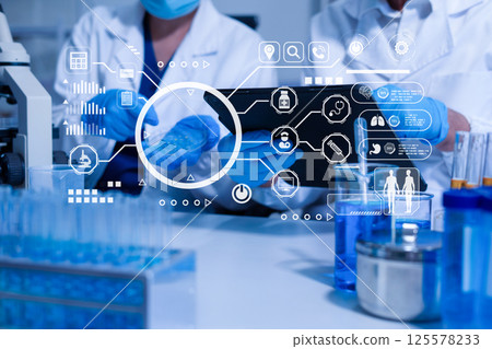 Lab work, Doctor holds a test tube takes the test from a test tube in analysis. Lab work, Doctor holds a test tube takes the test from a test tube in analysis. 125578233