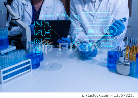 Lab work, Doctor holds a test tube takes the test from a test tube in analysis. Lab work, Doctor holds a test tube takes the test from a test tube in analysis. 125578235