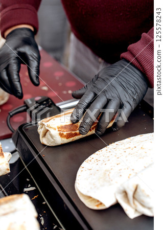 Chef Preparing Street Food Burrito Chef Preparing Street Food Burrito 125578243
