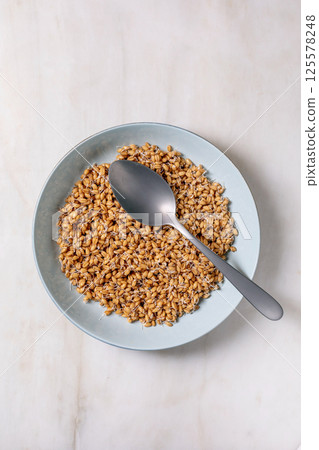 Sprouted Wheat Grains Bowl with Spoon Sprouted Wheat Grains Bowl with Spoon 125578248