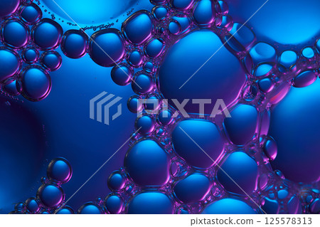 Composition of cosmetic essence bubbles, with alternating sizes, arranged closely together, floating on the surface of the dark blue liquid. Cosmetic molecules are shaped like shiny glass balls. 125578313