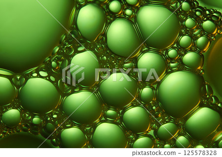 Transparent and microscopic crystal spheres arranged side by side to form a large array. The spheres have a smooth, glossy and green-tinged surface with a thin border around the outside. Transparent and microscopic crystal spheres arranged side by side to form a large array. The spheres have a smooth, glossy and green-tinged surface with a thin border around the outside. 125578328