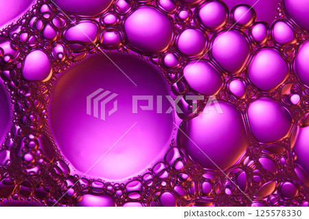 Soap bubbles floated on the purple liquid, light reflecting off the surface of each bubble. Countless tiny bubbles piled up on top of each other, filling the spaces between the larger bubbles. Soap bubbles floated on the purple liquid, light reflecting off the surface of each bubble. Countless tiny bubbles piled up on top of each other, filling the spaces between the larger bubbles. 125578330