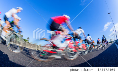 Cycling Riders Race Motion Speed Blur Close-up Cycling Riders Race Motion Speed Blur Close-up 125578465