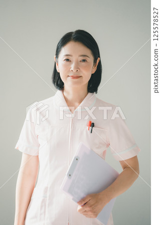 Nurse in her 50s Nurse in her 50s 125578527