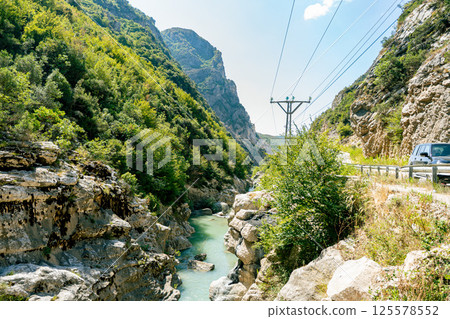Small stream along a sunny road in Albania 125578552