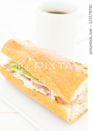 A delicious chicken and bacon Parisian sandwich and hot coffee for breakfast A delicious chicken and bacon Parisian sandwich and hot coffee for breakfast 125579792