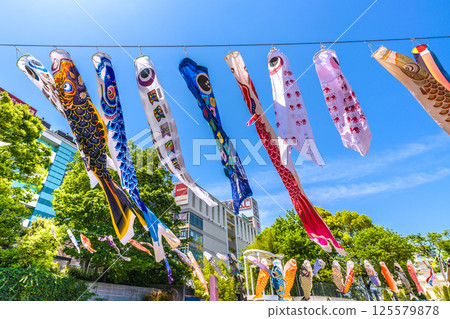 Yokohama cityscape in Japan - View of carp streamers in front of the subway "Center Minami Station" 125579878