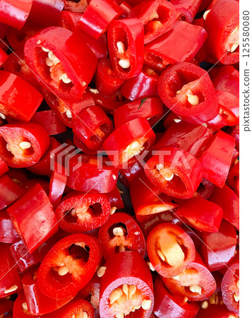 Chopped Fresh Red Hot Chili Close-Up. Chopped Fresh Red Hot Chili Close-Up. 125580080