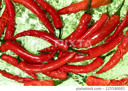 Fresh Red Hot Chili Peppers In Water Top View 125580081