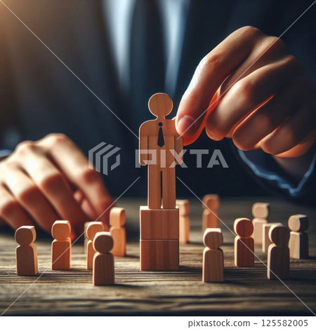 Choosing a leader among wooden figurines. 125582005