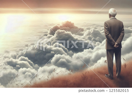 An elderly man standing on top among the clouds. Space for text. An elderly man standing on top among the clouds. Space for text. 125582015