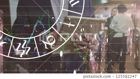 Image of zodiac signs and data processing over diverse business people Image of zodiac signs and data processing over diverse business people 125582247
