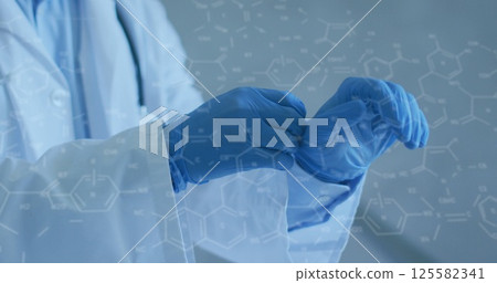 Image of chemical structures over caucasian male doctor wearing face mask and gloves 125582341