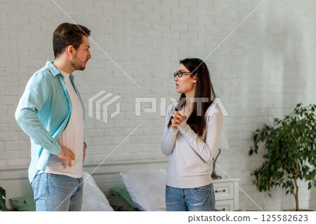 Couple Having Serious Conversation at Home Couple Having Serious Conversation at Home 125582623