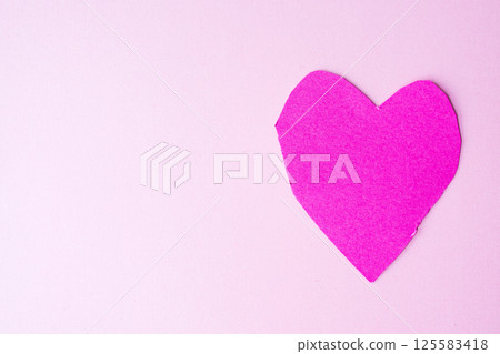 Pink paper heart on soft pastel background for decor or craft 125583418