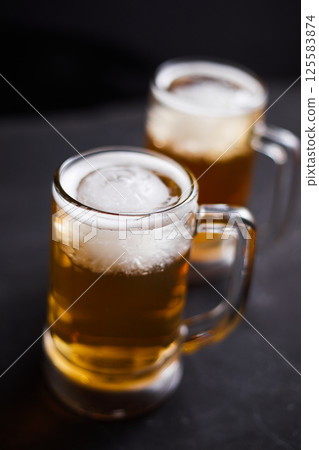 mug of beer on wooden table mug of beer on wooden table 125583874