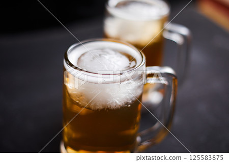 mug of beer on wooden table mug of beer on wooden table 125583875