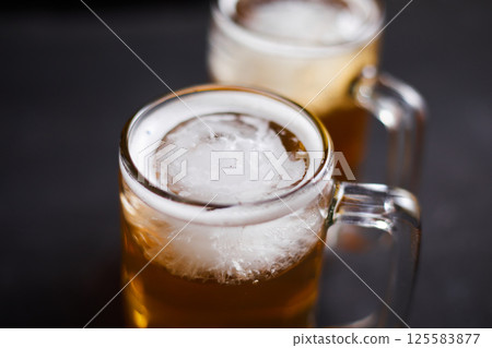mug of beer on wooden table mug of beer on wooden table 125583877