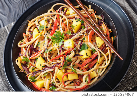 Thai Mango Noodle Veggie Salad in a bowl 125584067